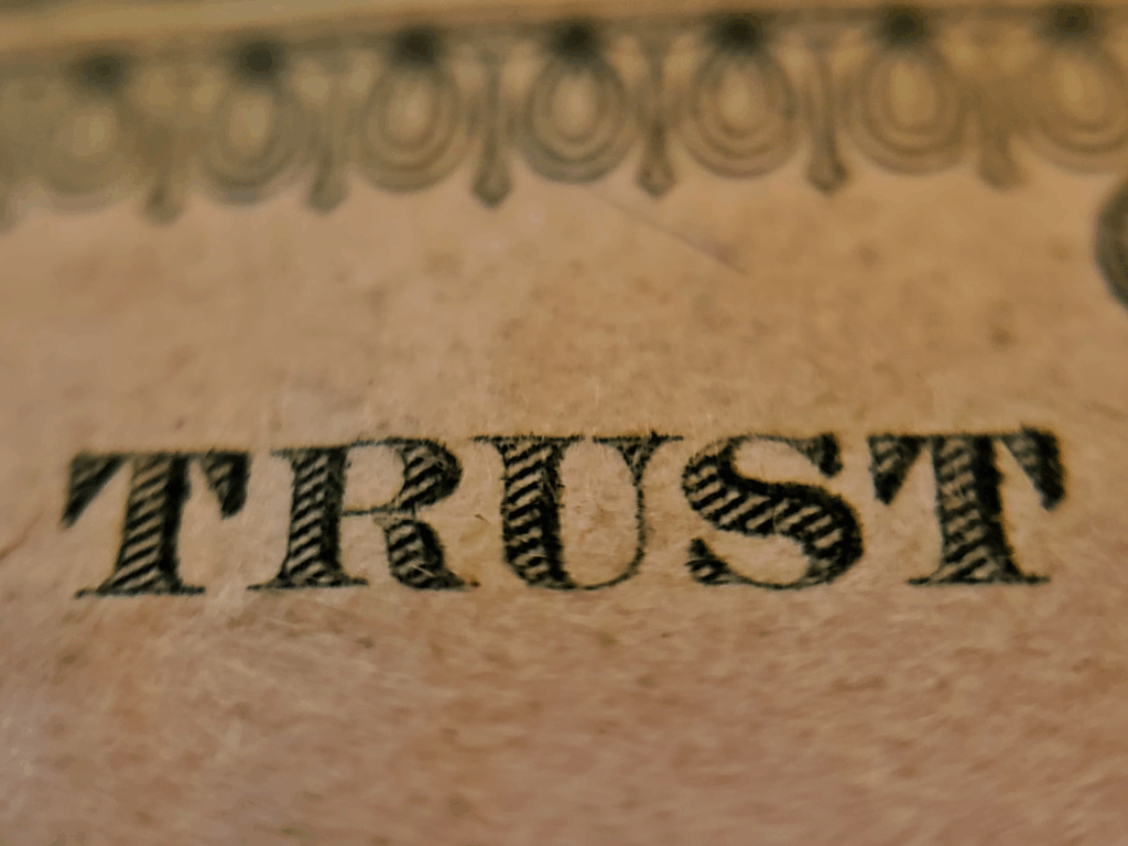 Closeup of the word TRUST